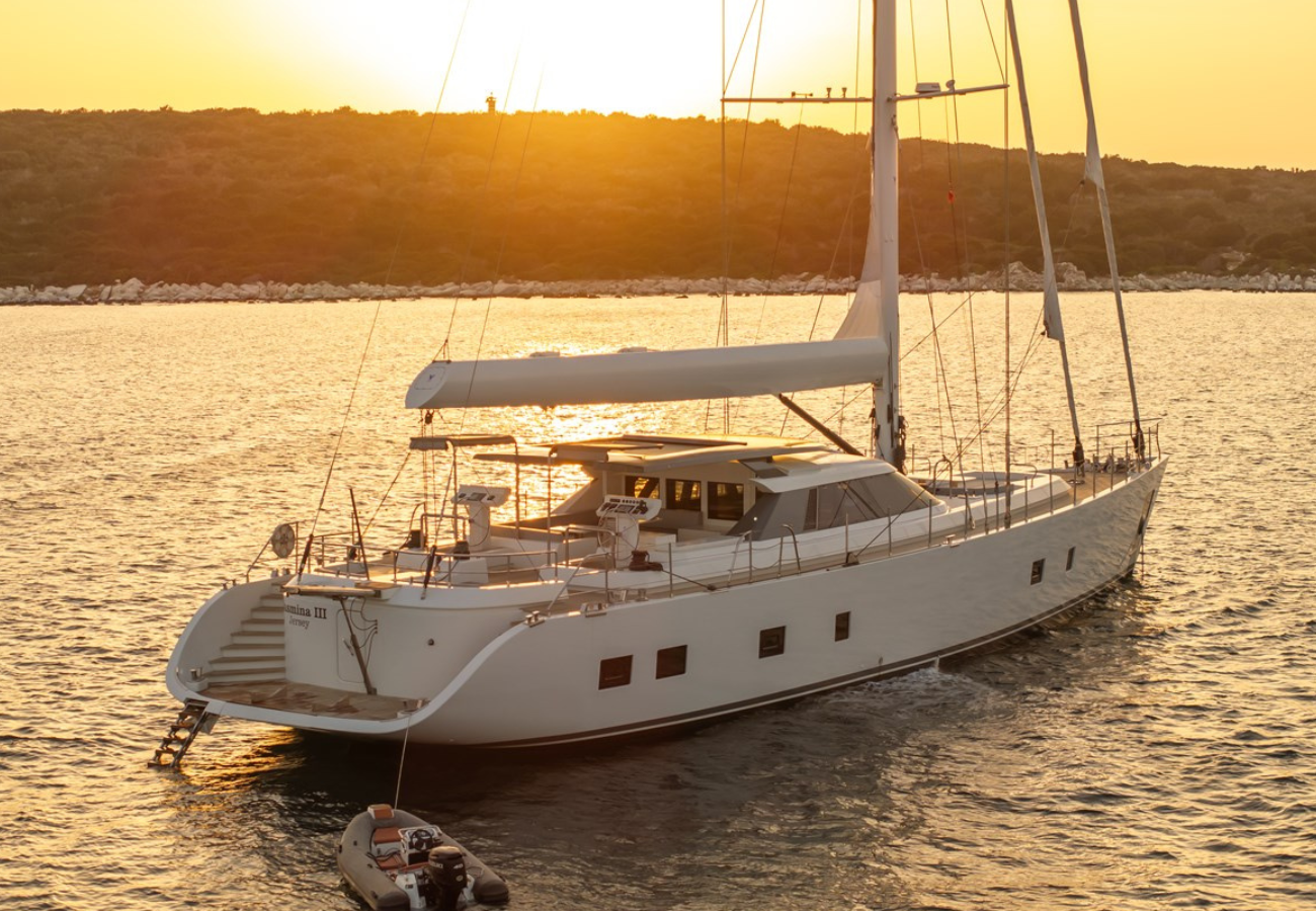 Exterior image of ARK Yacht JASMINA III 30.6m sailing yacht for sale showcasing her elegant sailing profile, classic hull lines, and well-proportioned open deck areas.