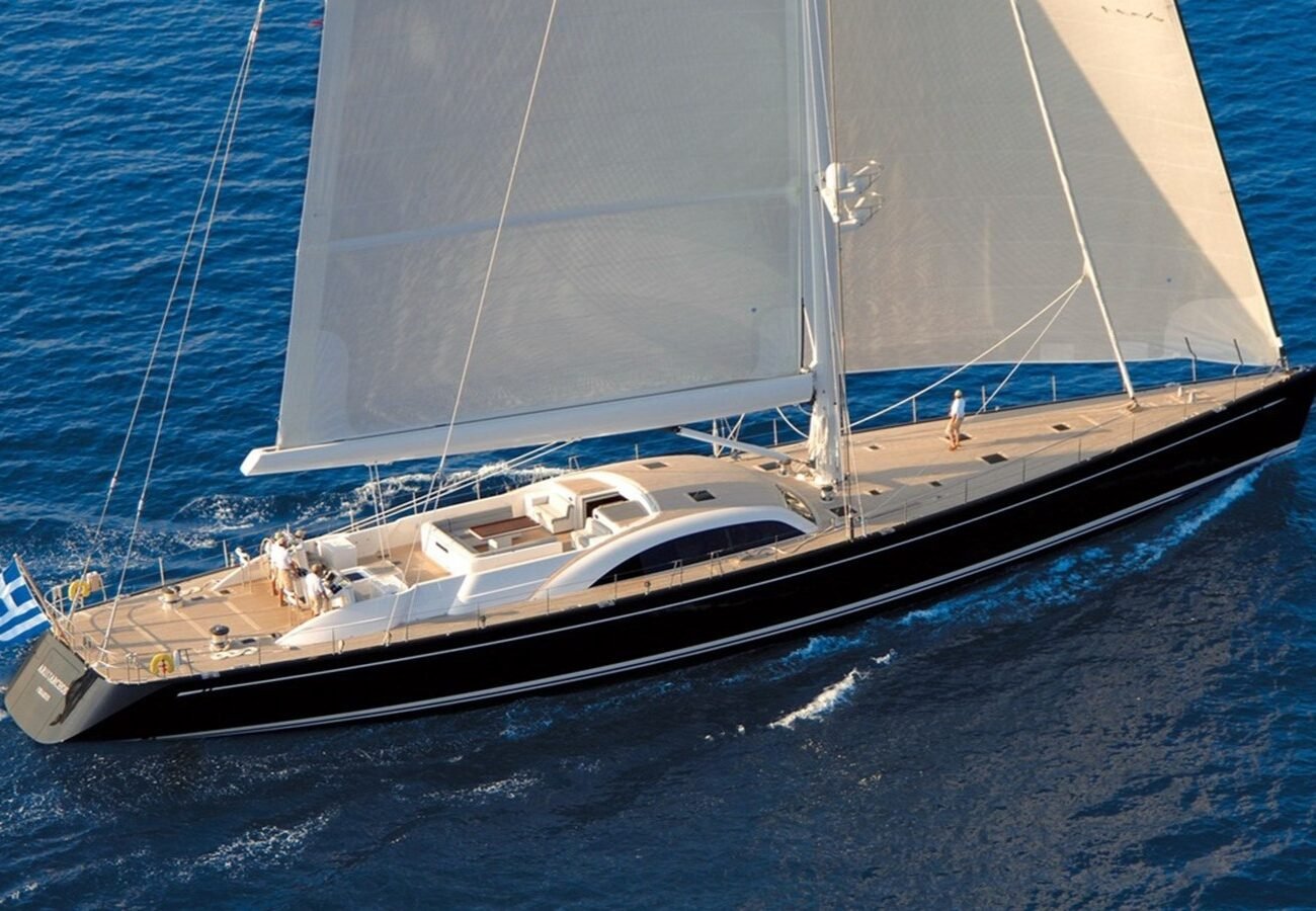 Exterior image of Nautor Swan ARISTARCHOS 39.93m sailing yacht for sale showcasing her elegant sailing profile, sleek hull lines, and expansive open deck areas.
