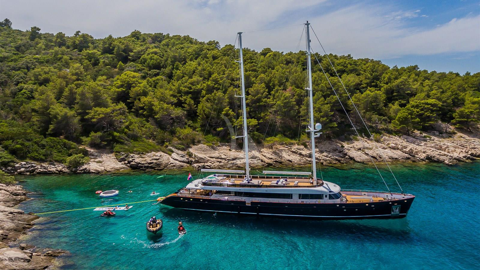 Exterior image of TRAMONTANA CLASE AZUL sailing yacht for sale showcasing her elegant sailing profile, clean hull lines, and expansive open deck areas.