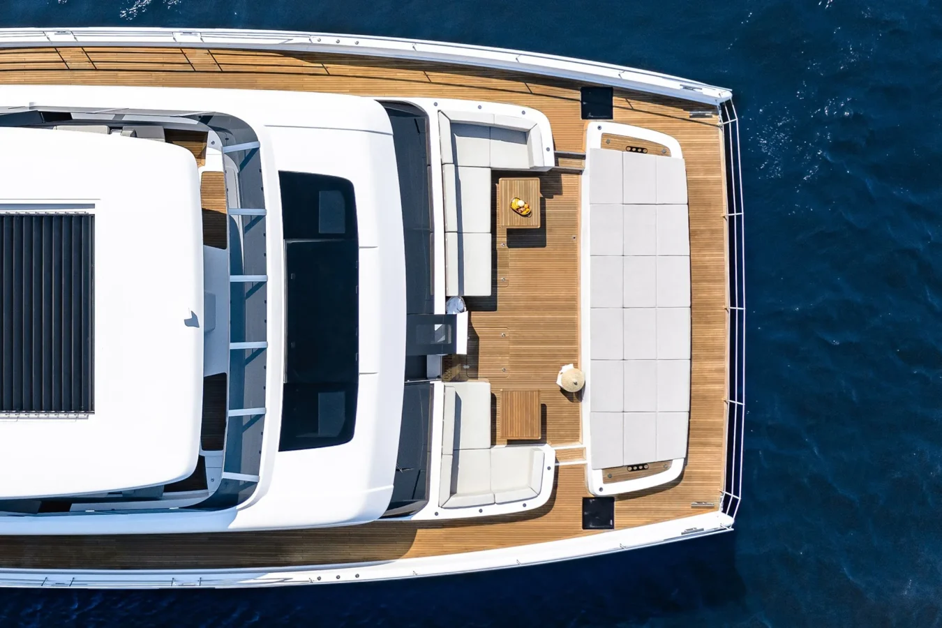 Spacious sundeck on Sunreef Yachts 80 Kokomo with sun loungers and panoramic sea views.