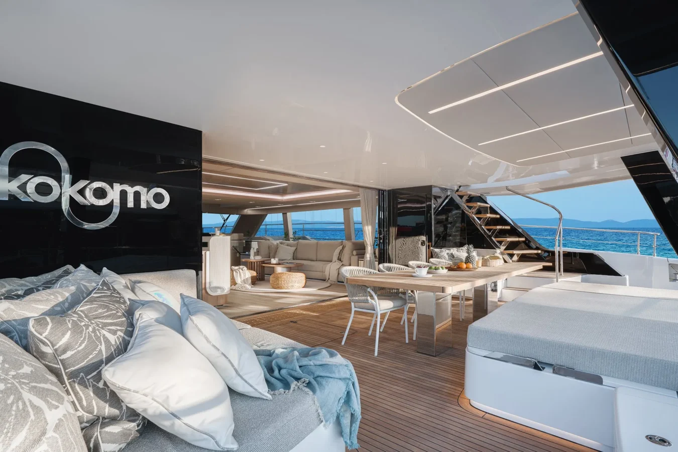 Elegant aft dining area on Sunreef Yachts 80 Kokomo with a beautifully set table overlooking the sea.