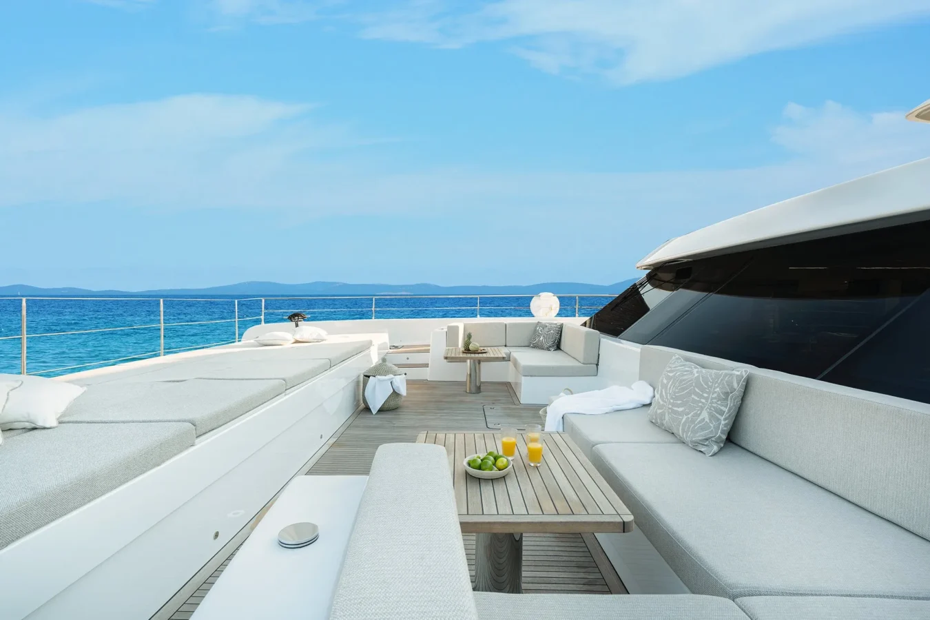 Expansive sundeck on Sunreef Yachts 80 Kokomo with sun loungers and panoramic ocean views.