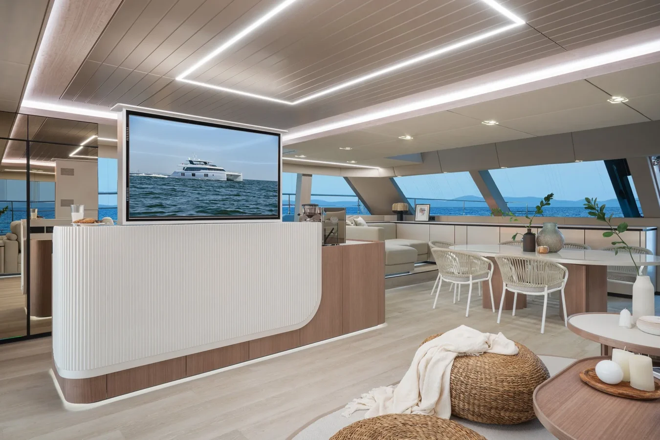 Sliding TV screen positioned between the bar and sitting area on Sunreef Yachts 80 Kokomo.