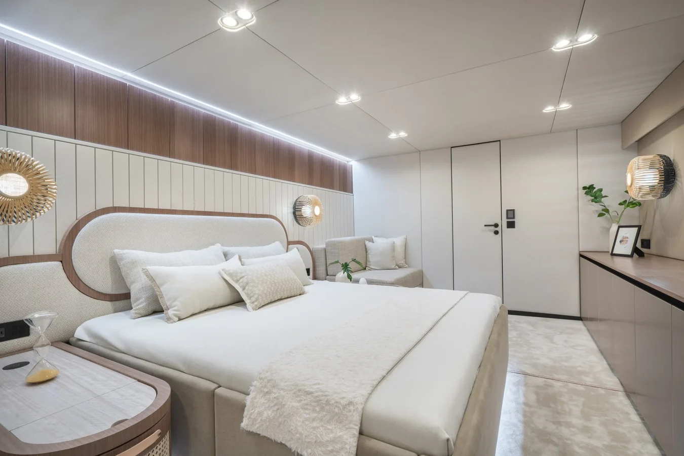 Elegant and spacious stateroom on Sunreef Yachts 80 Kokomo with luxurious bedding and soft lighting.