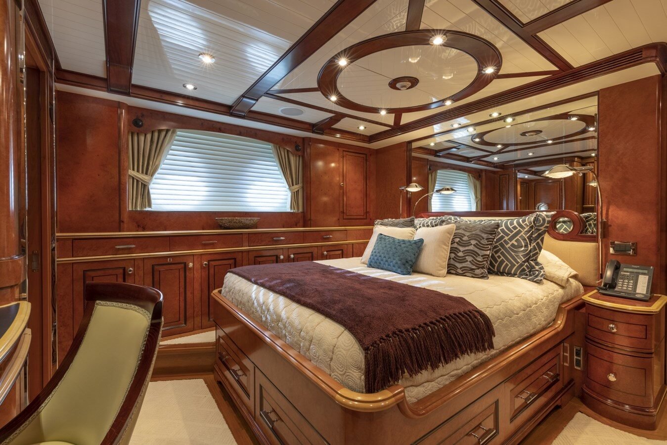 BURGER BOAT COMPANY NADAN 151 owner’s cabin with luxurious wood finishes and elegant design.