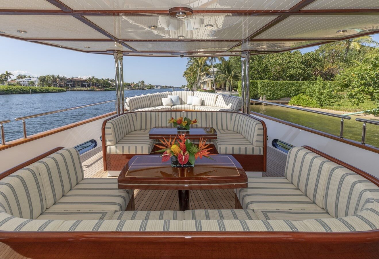 BURGER BOAT COMPANY NADAN 151 aft dining and lounge area with panoramic sea view.