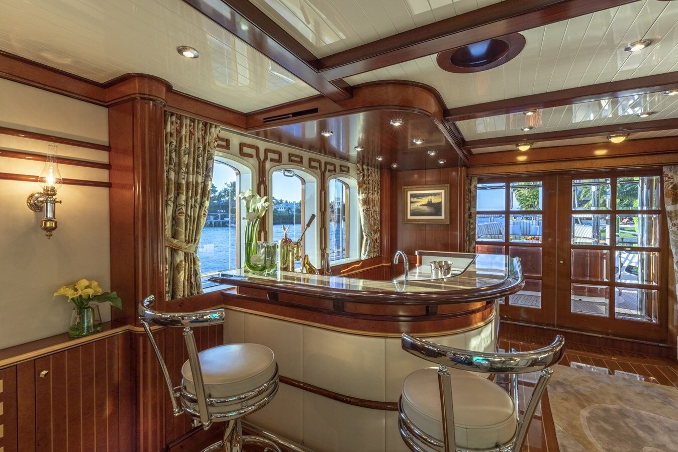 BURGER BOAT COMPANY NADAN 151 bar area with elegant wood finishes and stylish seating.