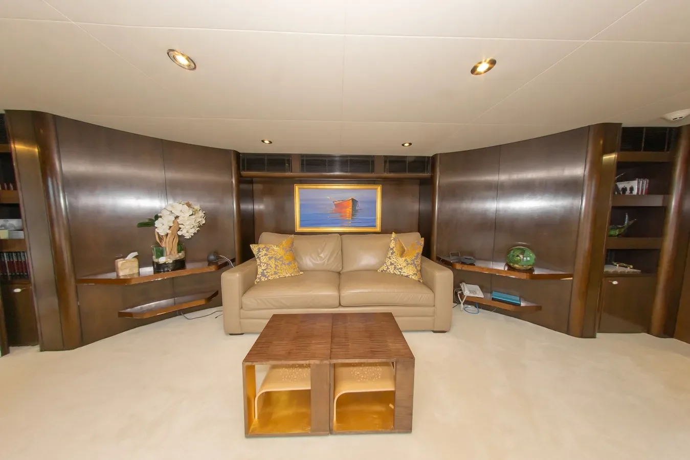 Oceanfast 164 High Occupancy yacht deck with sofa and table arranged for relaxation