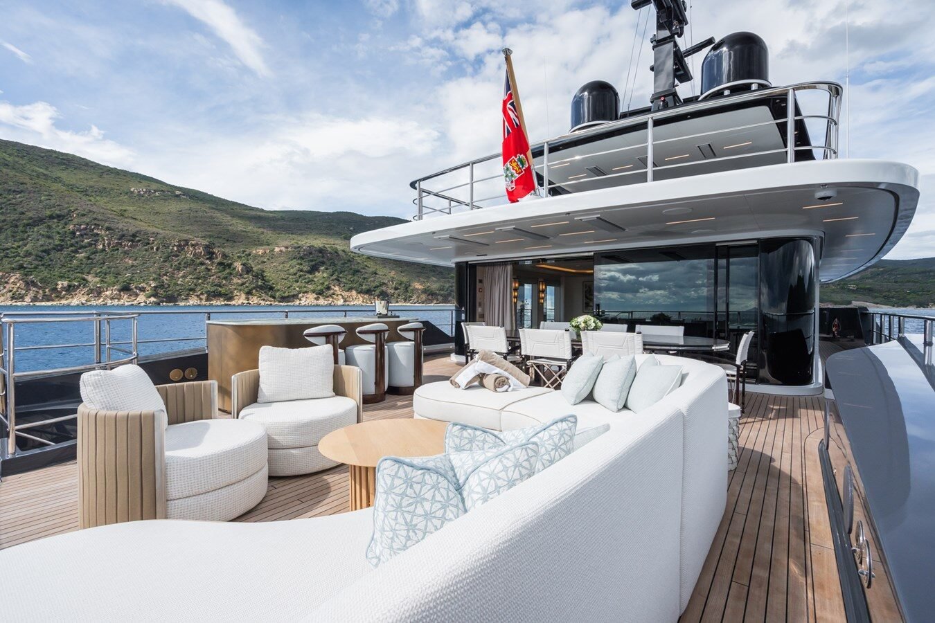 Aft lounge area of Sanlorenzo 154 500Exp M with plush seating and open sea views.