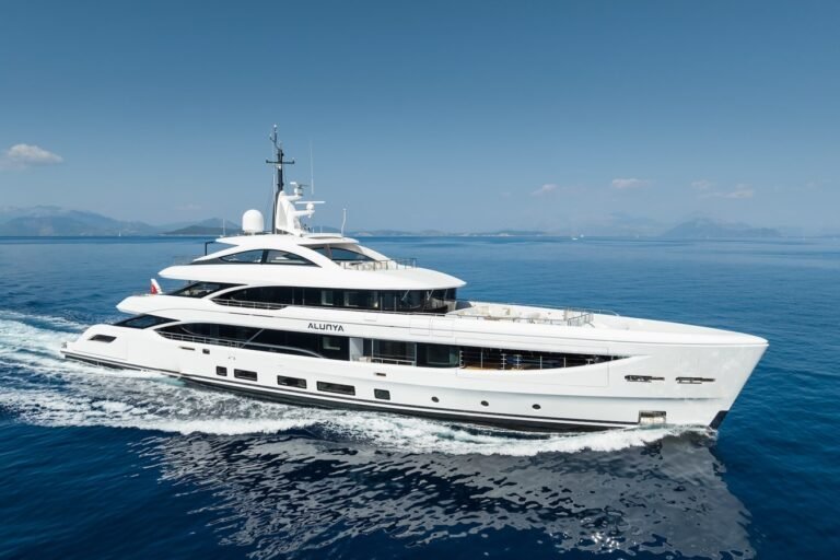 Benetti 163 Alunya cruising on the open sea, showcasing its sleek design and elegant profile.