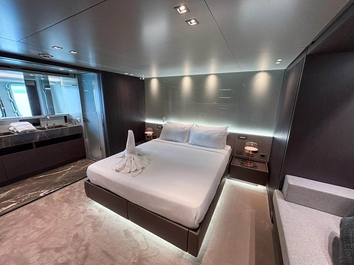 Sanlorenzo SX88 owner’s bedroom with panoramic windows and king-size bed
