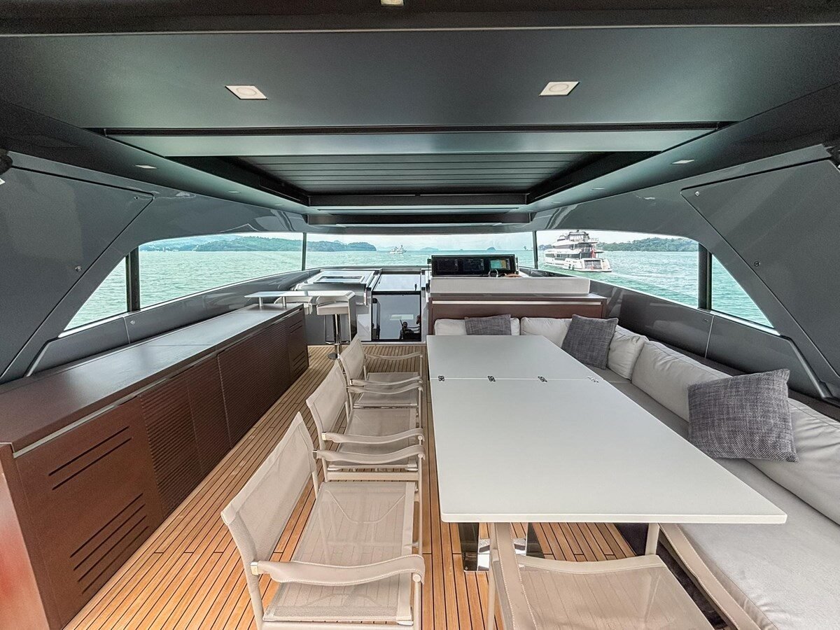 Sanlorenzo SX88 alfresco dining area on flybridge under hardtop