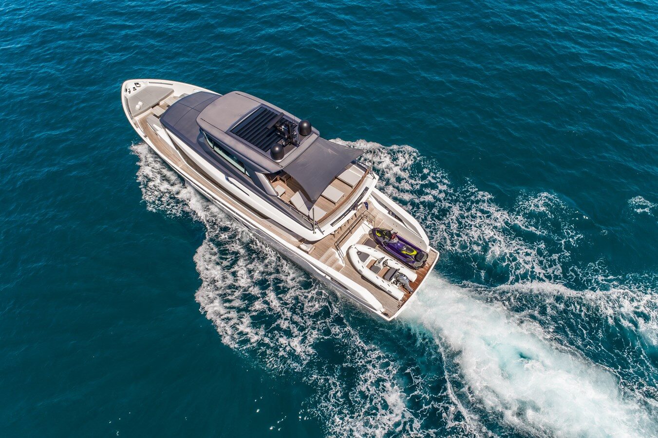 Sleek lines and modern styling define the Sanlorenzo SX76 Violetta cruising along the Athens coastline