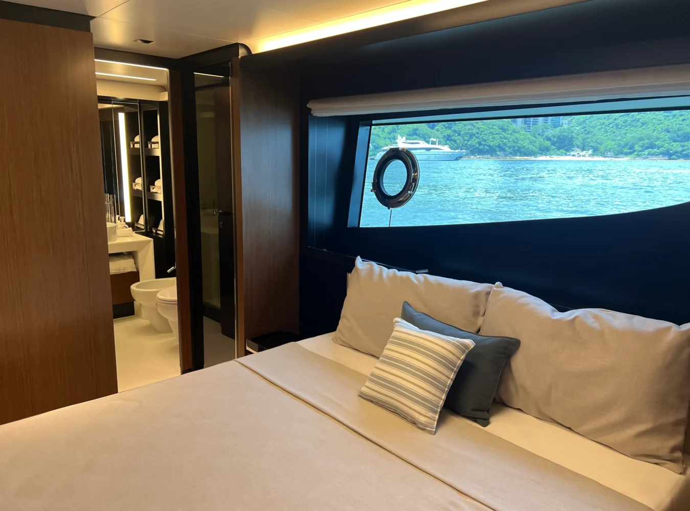 Below deck double bed cabin on the Riva 102’ Corsaro Super with elegant décor and premium comfort.
