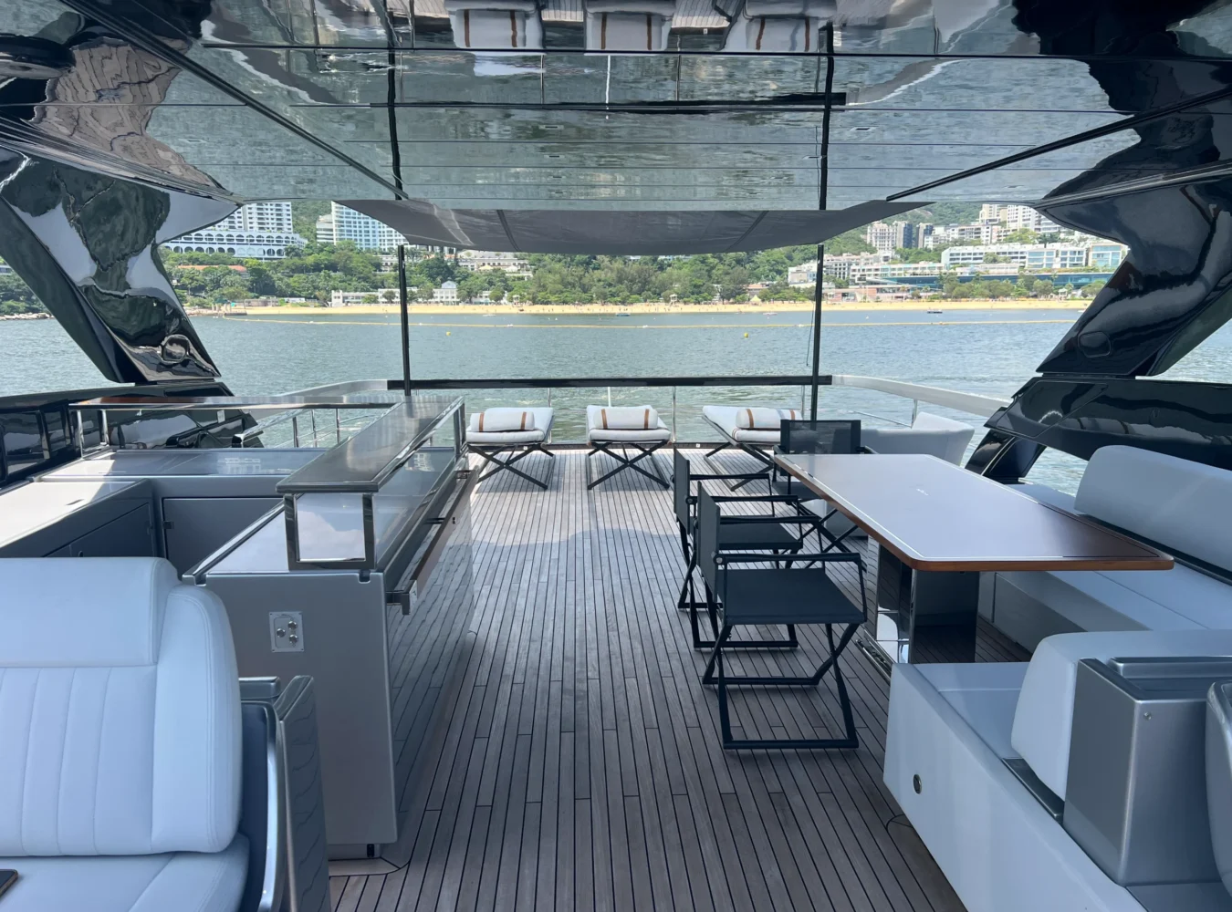 Spacious flybridge on Riva 102’ Corsaro Super with seating, sunpads, and wide sea views