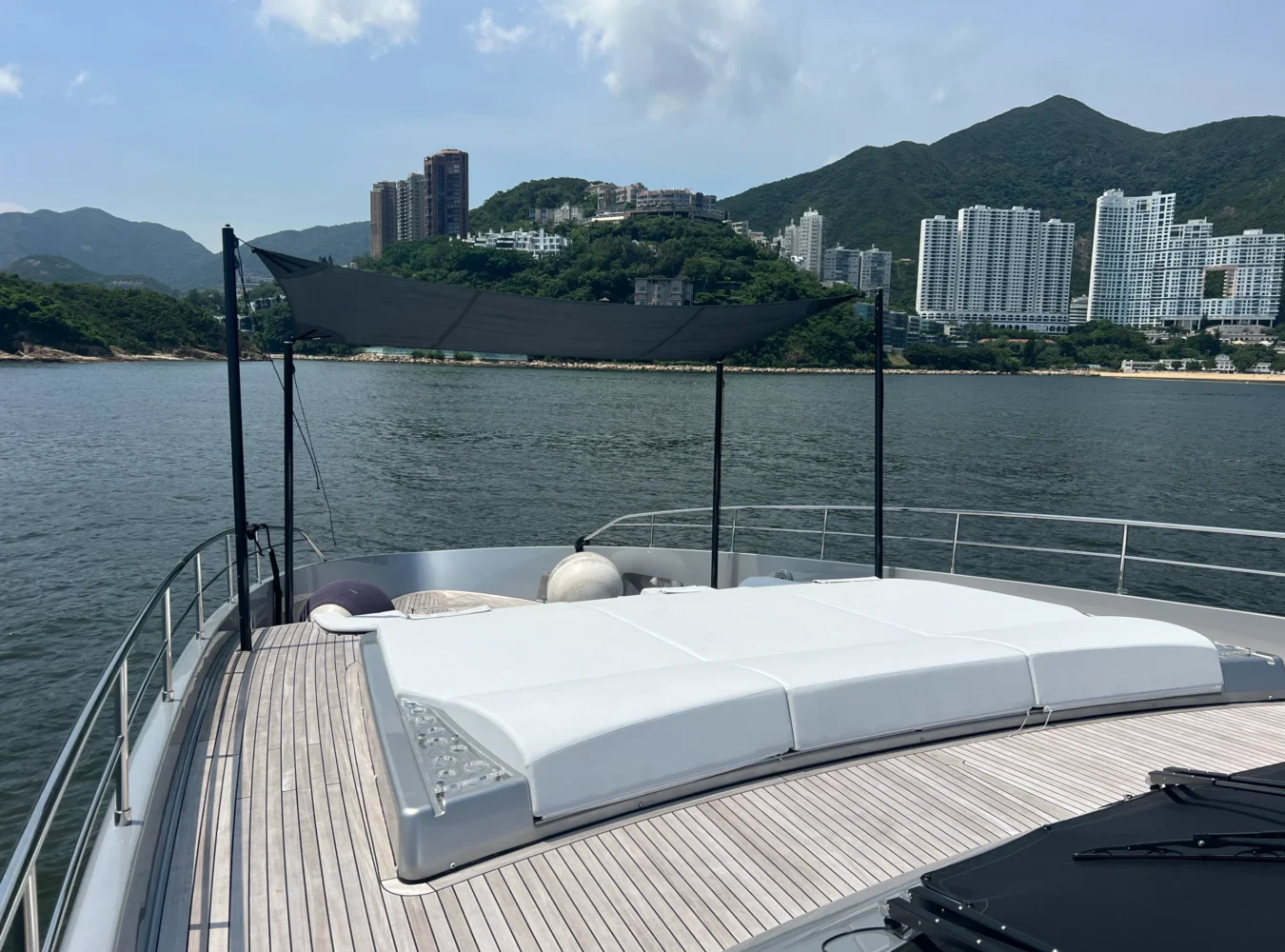 Main deck bow lounge area on the Riva 102’ Corsaro Super with elegant sun pads and open seating.