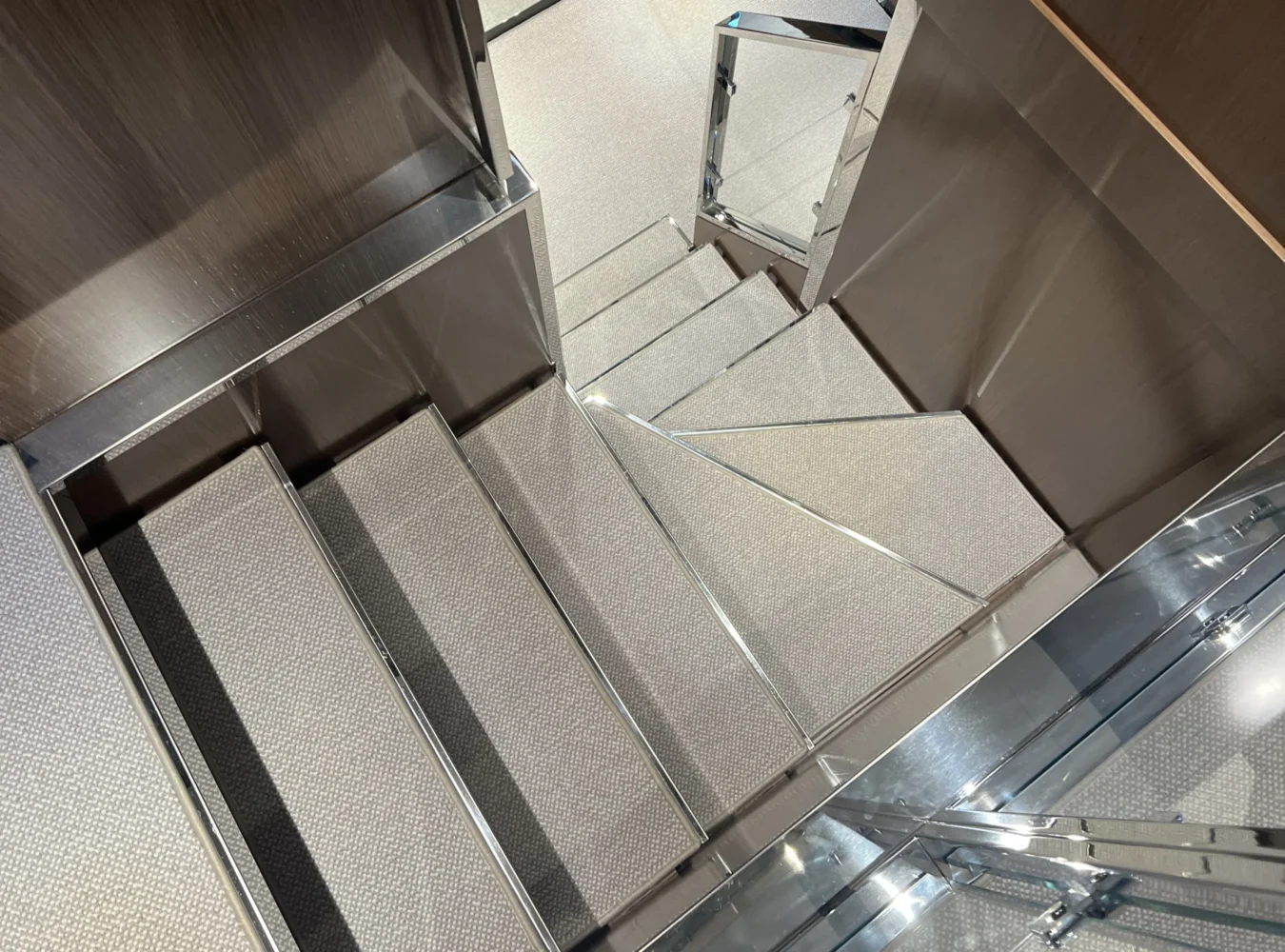 Main deck staircase aboard Riva 102’ Corsaro Super with elegant design and polished finishes.