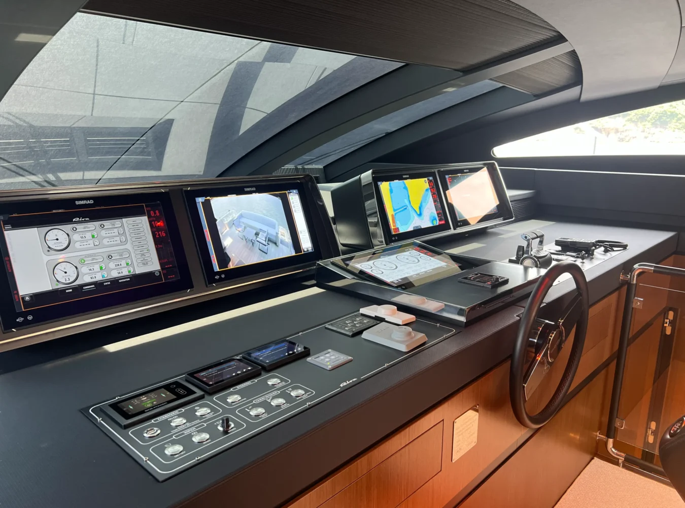 Riva 102’ Corsaro Super helmstation with advanced control panels and modern navigation systems.