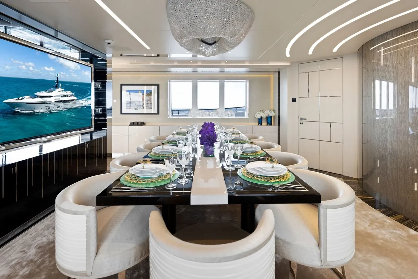 Interior dining area on Bilgin Yachts 156 Moonraker with TV and elegant seating.