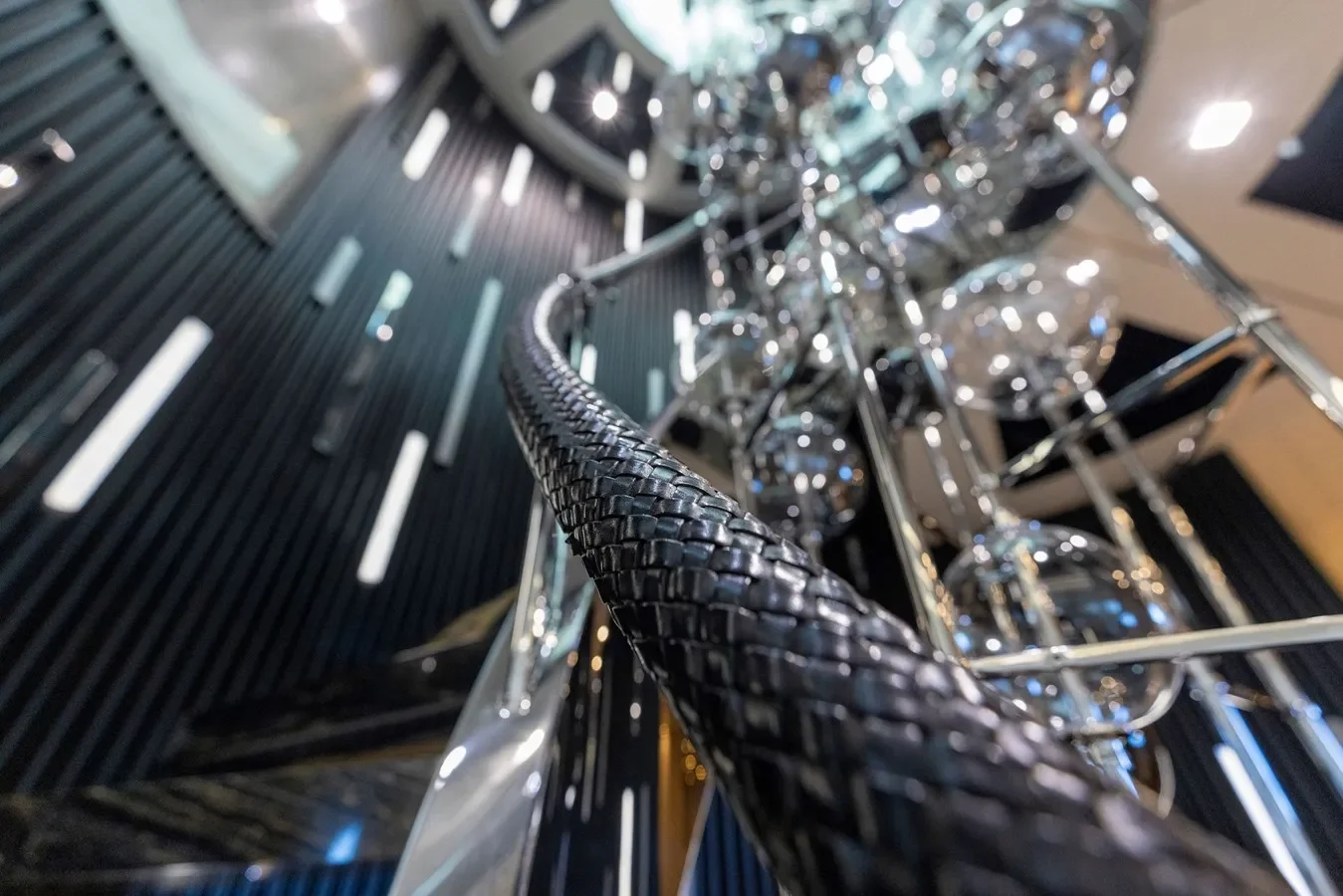 Elegant yacht staircase with natural light and refined detailing.