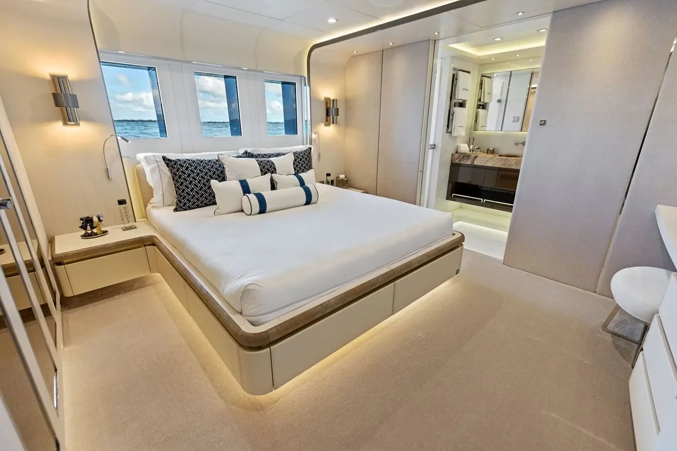 Elegant yacht guest bedroom with refined finishes and cozy ambiance.