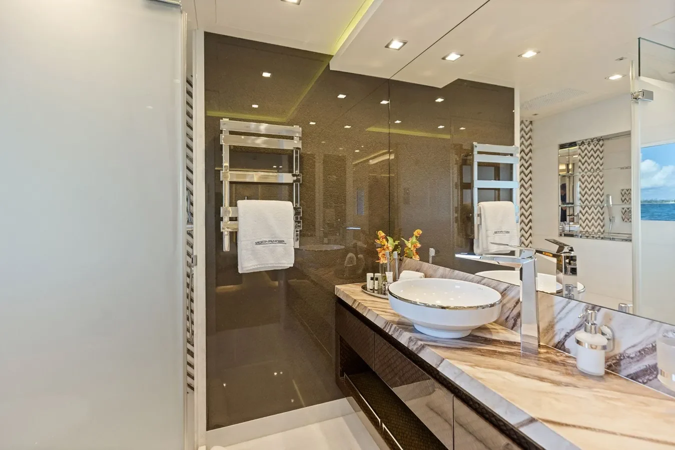 Elegant yacht bathroom with marble finishes, spacious shower, and refined details.