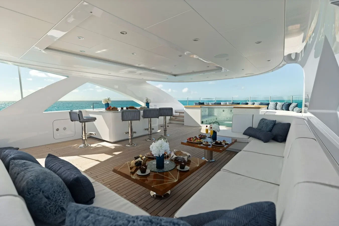 Flybridge lounge aboard Bilgin Yachts 156 “Moonraker” with bar area and Jacuzzi under open skies.