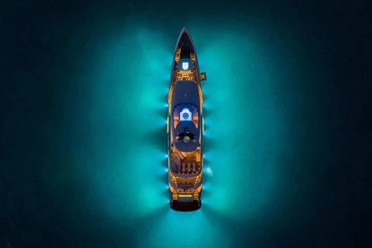 Aerial night view of Bilgin Yachts 156 Moonraker illuminated with glowing lights.
