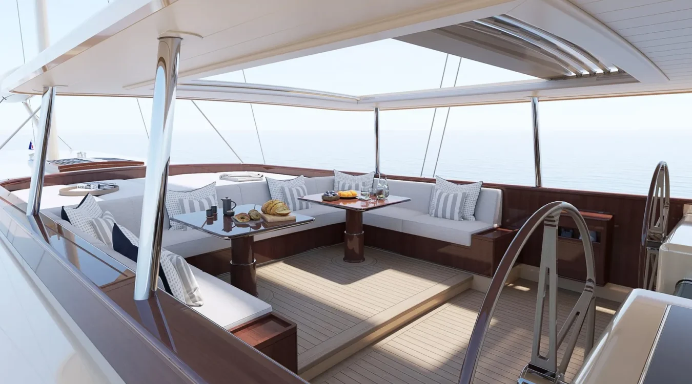 Alfresco dining and lounge area on Ares 62 Simena with cushioned seating, twin tables, and panoramic sea views.