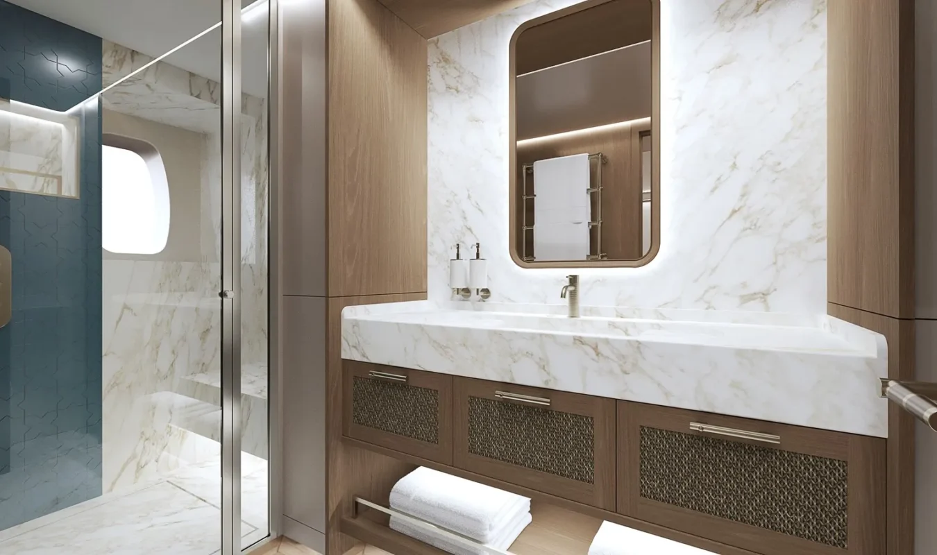 Elegant yacht bathroom with marble sink, wood cabinetry, and glass-enclosed shower aboard the Ares 62 Simena.
