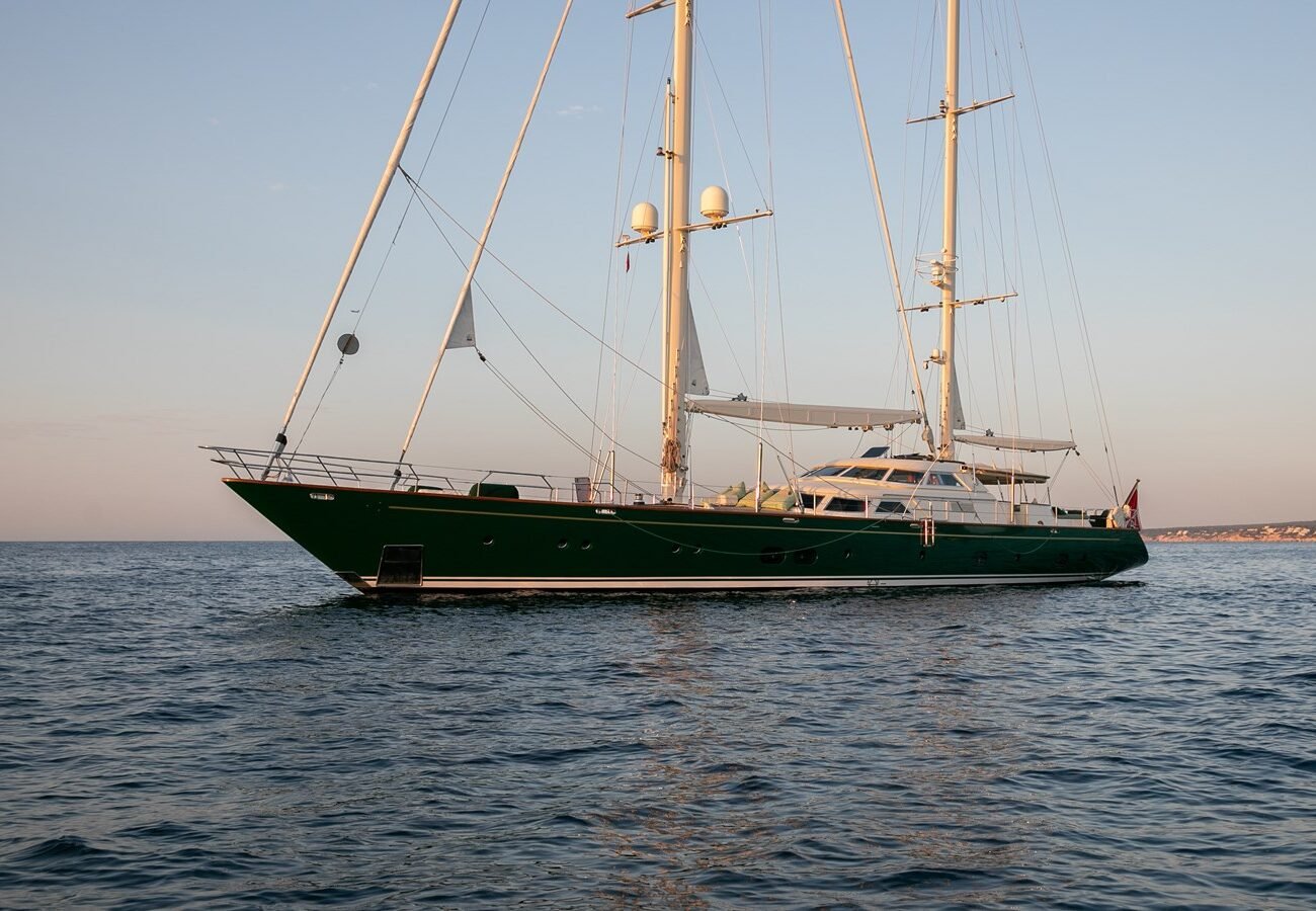 Perini Navi 121 Norfolk Star sailing yacht full profile view at sea during sunset