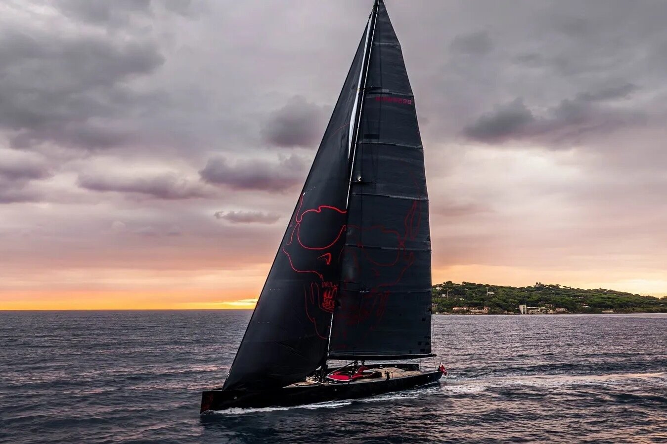Wally 130 Black Sails cruising in the open sea, showcasing her sleek hull and sails in motion.