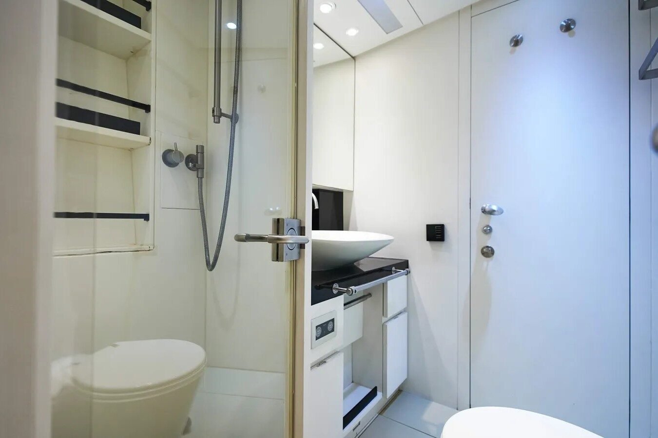 Spacious bathroom of Wally 130 Black Sails featuring a shower, commode, and washbasin.