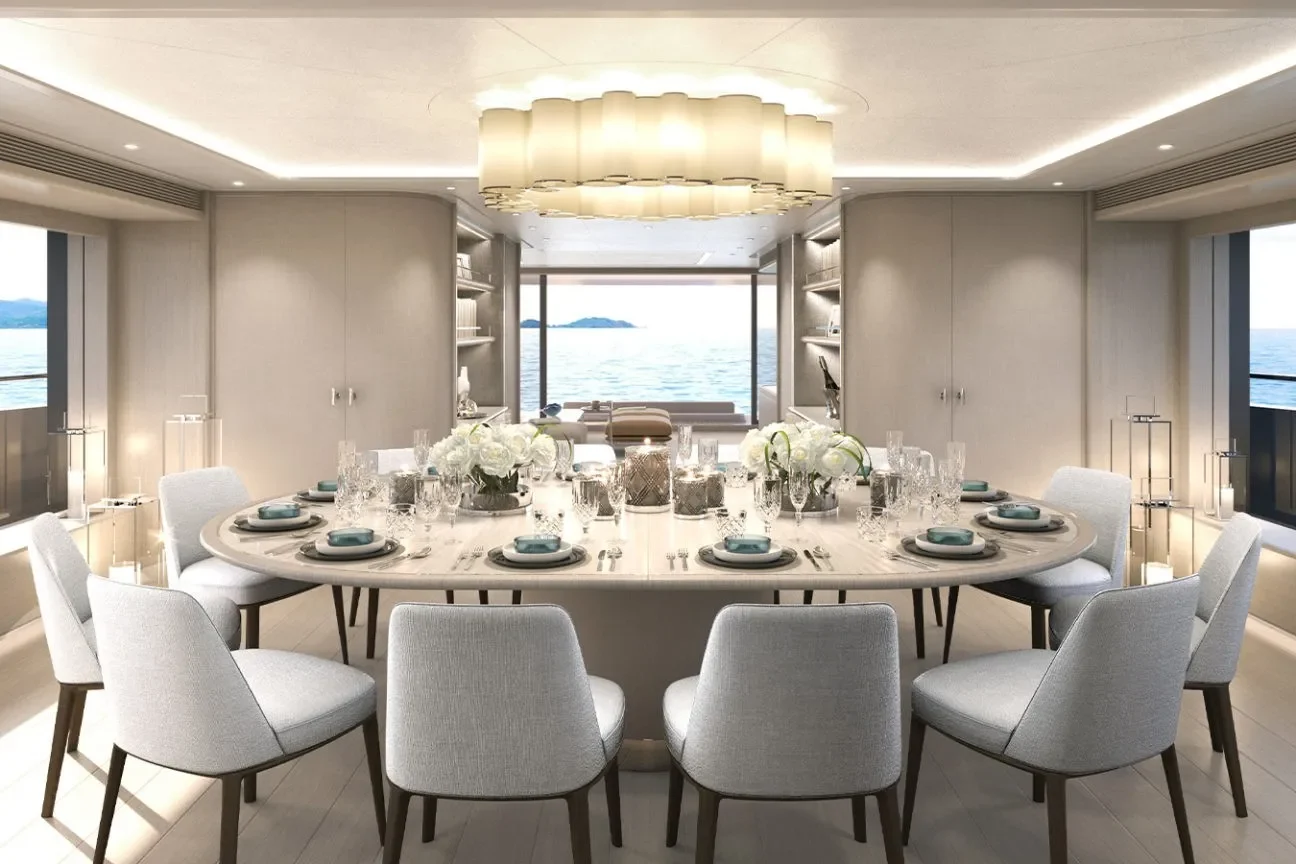 Elegant formal dining room aboard the GRACE 50M with extended oval table and sea views