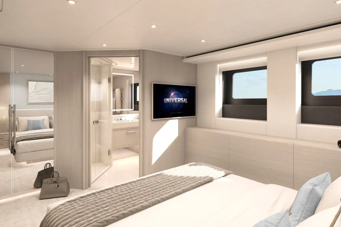 Elegant guest cabin interior on the Heesen GRACE 50M superyacht featuring large windows, king bed, and ensuite access