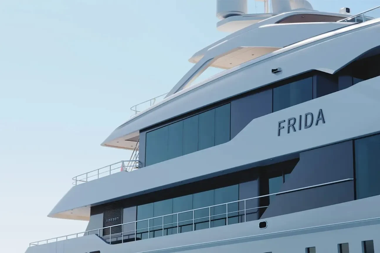 Exterior close-up of the Heesen FRIDA 55M yacht with the FRIDA nameplate