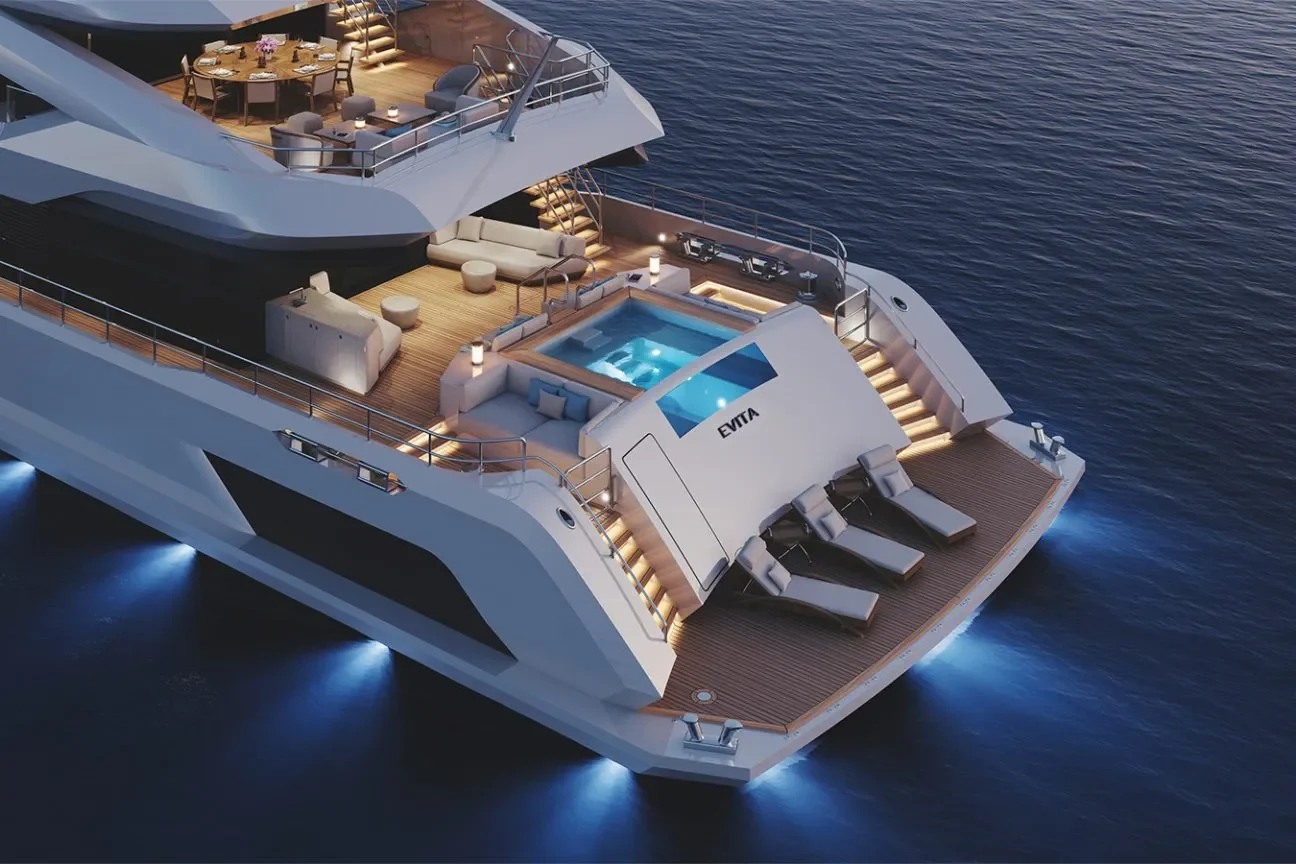 Aft deck pool and sun loungers on a luxury superyacht at dusk