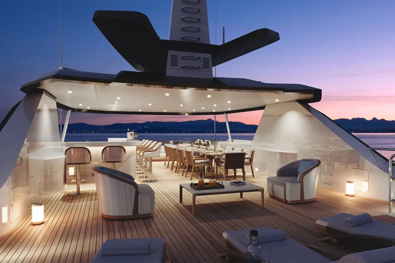 Elegant sundeck dining and lounge area on the Heesen Evita 57M superyacht at sunset.