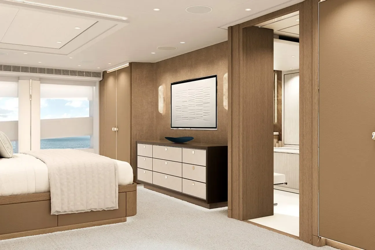 A spacious master cabin aboard the Heesen Evita 57M Superyacht with warm wood finishes.