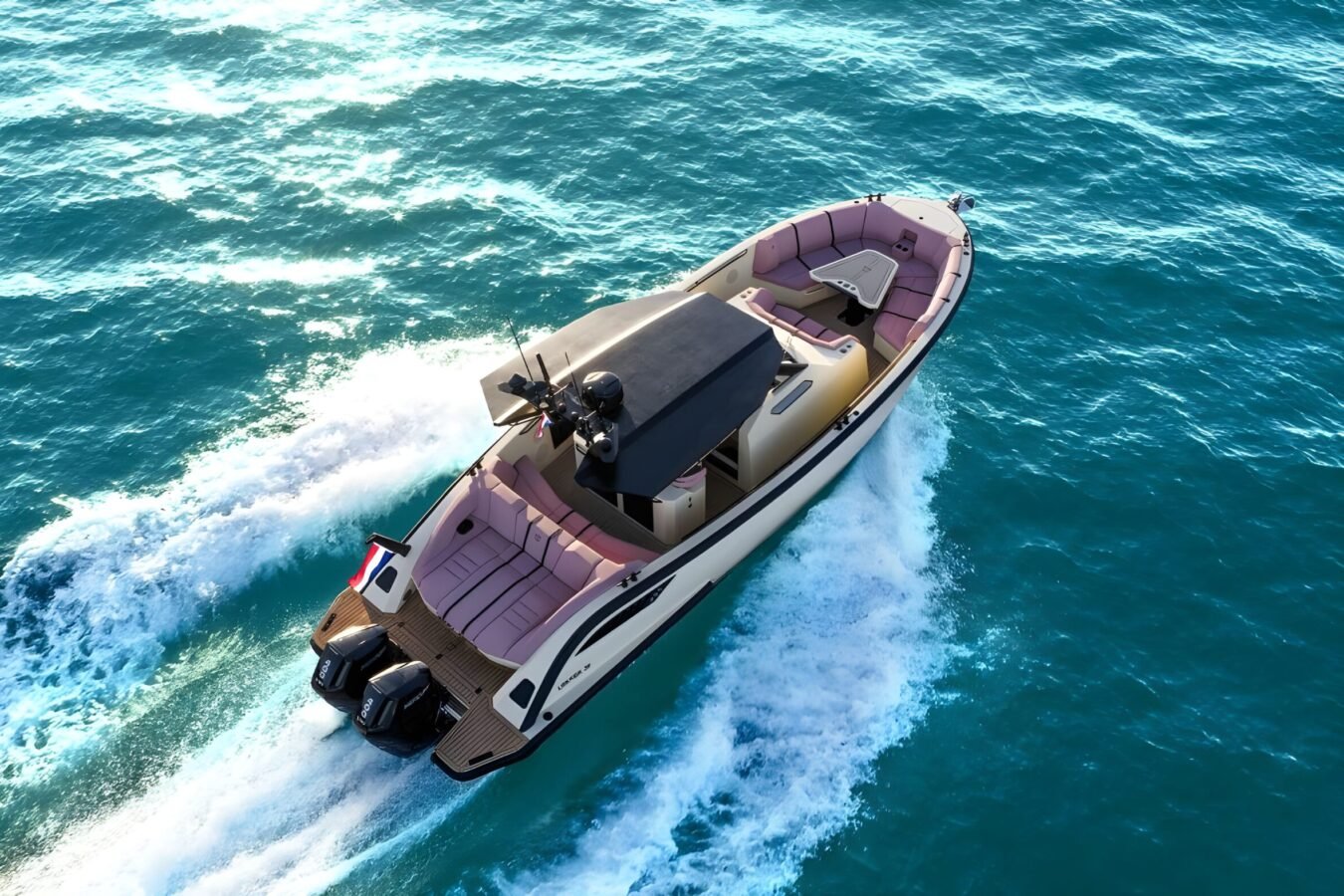 Aerial view of the LEKKER 38 yacht cruising at speed with open deck layout and twin outboards