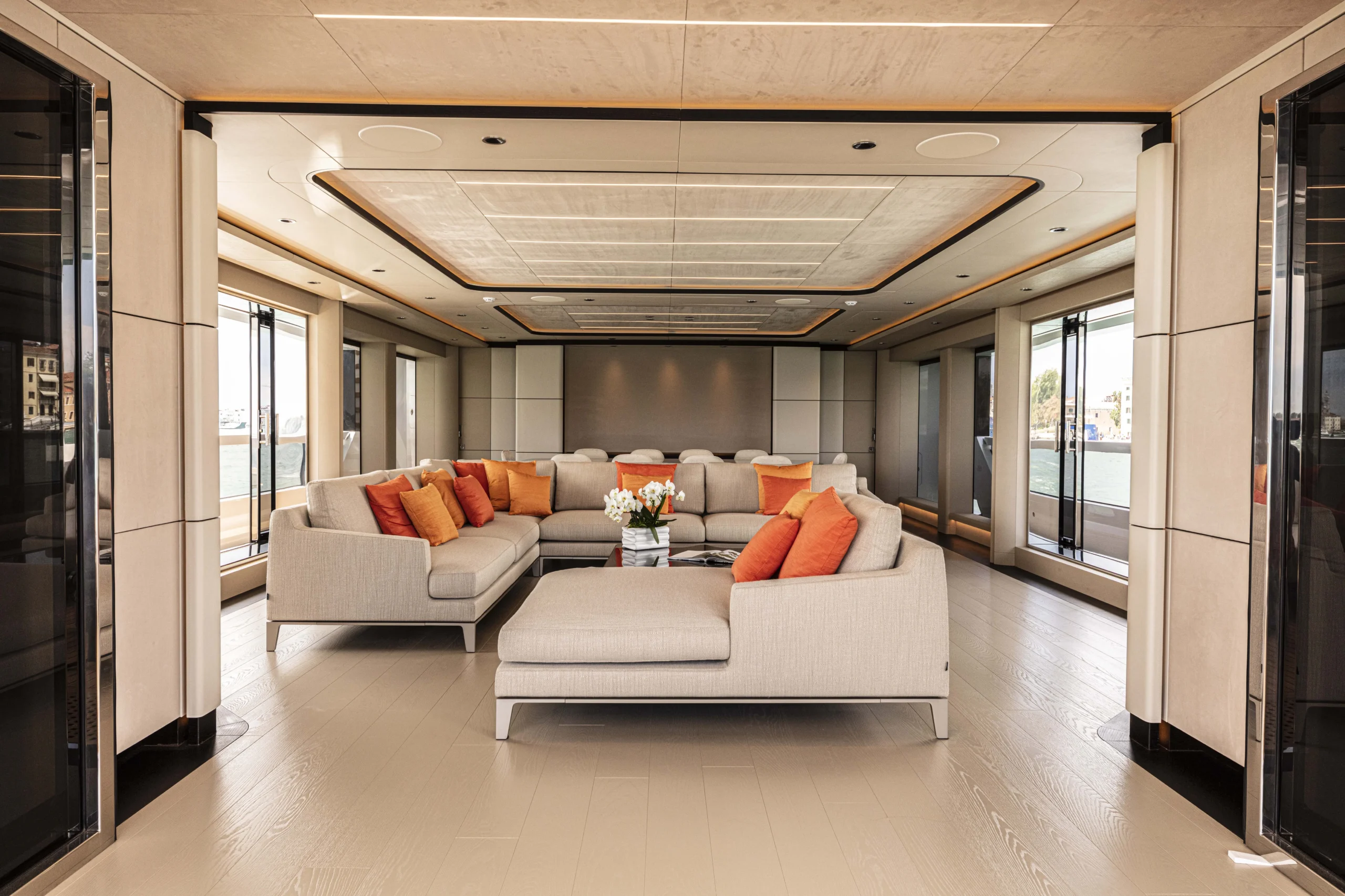 Ocean King Ducale 120 main salon with spacious lounge seating, panoramic windows, and contemporary interior design