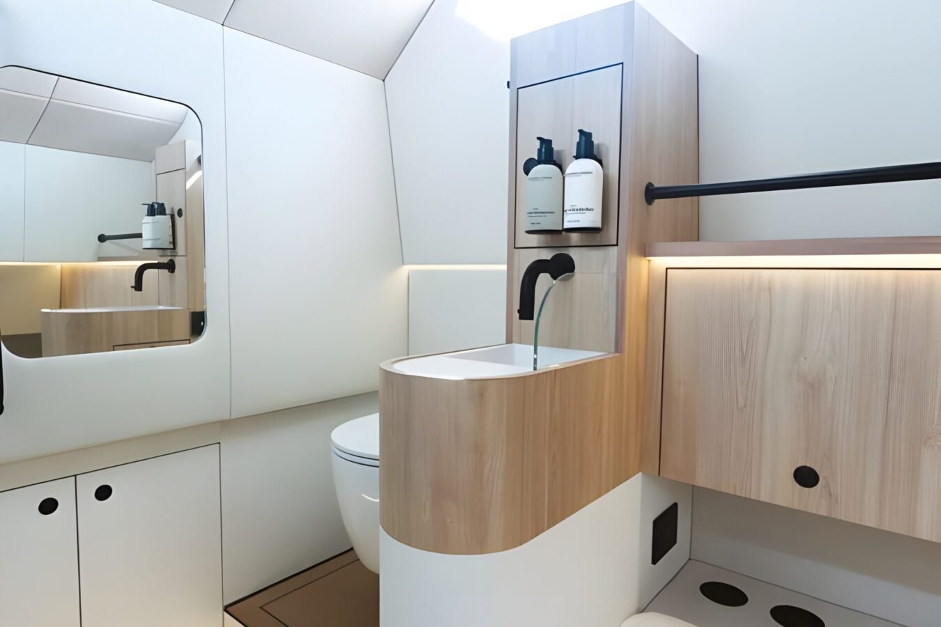 LEKKER 38 yacht bathroom interior with integrated toilet, sink unit, wood cabinetry, and modern lighting