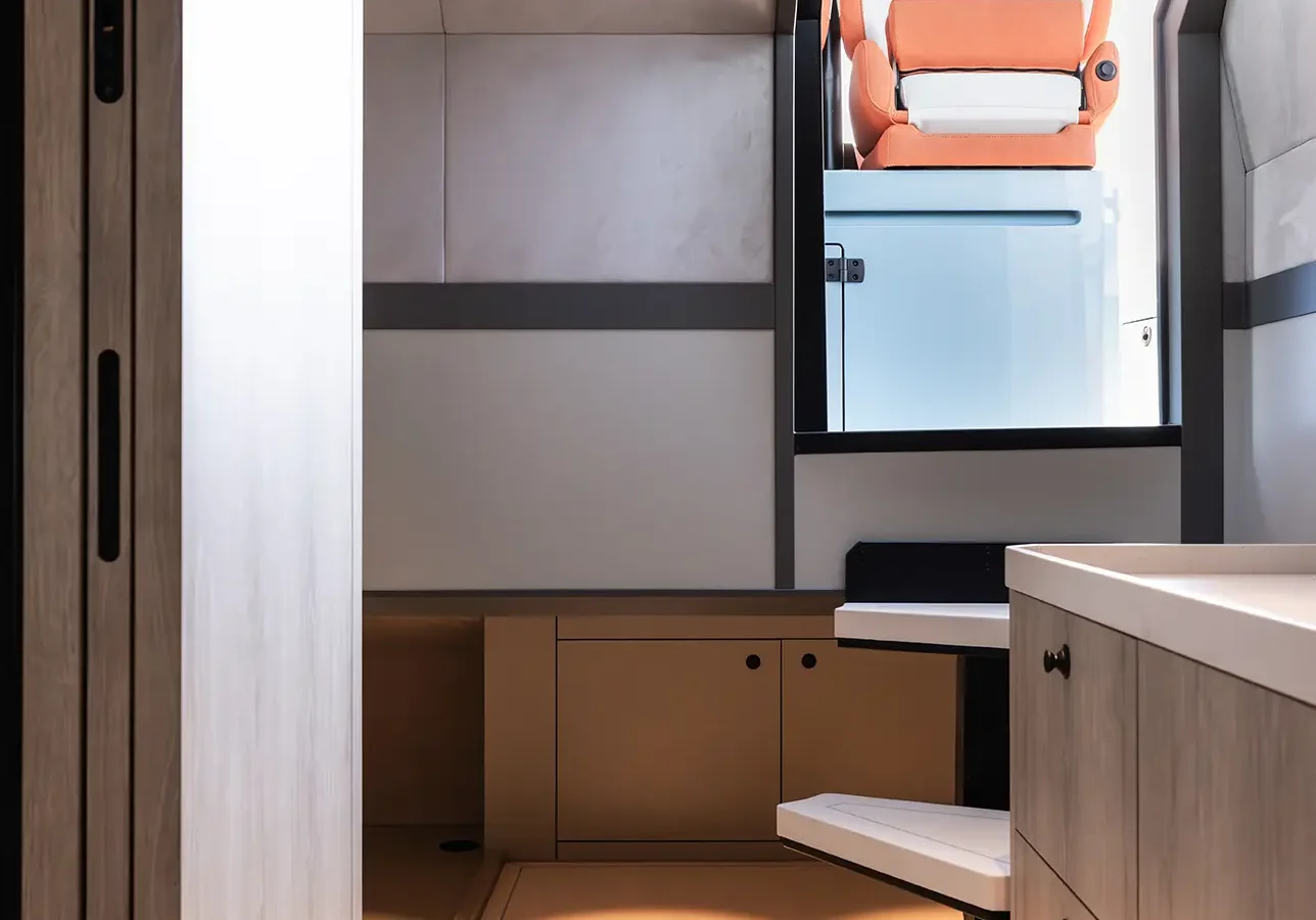 LEKKER 45 yacht interior corridor with seating and helm chair visible ahead