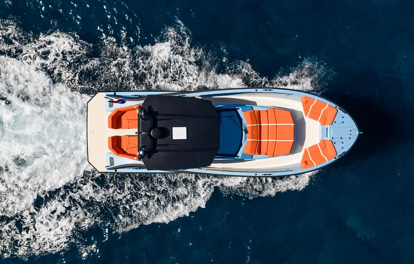 Top view of LEKKER 45 yacht cruising at speed with orange deck seating
