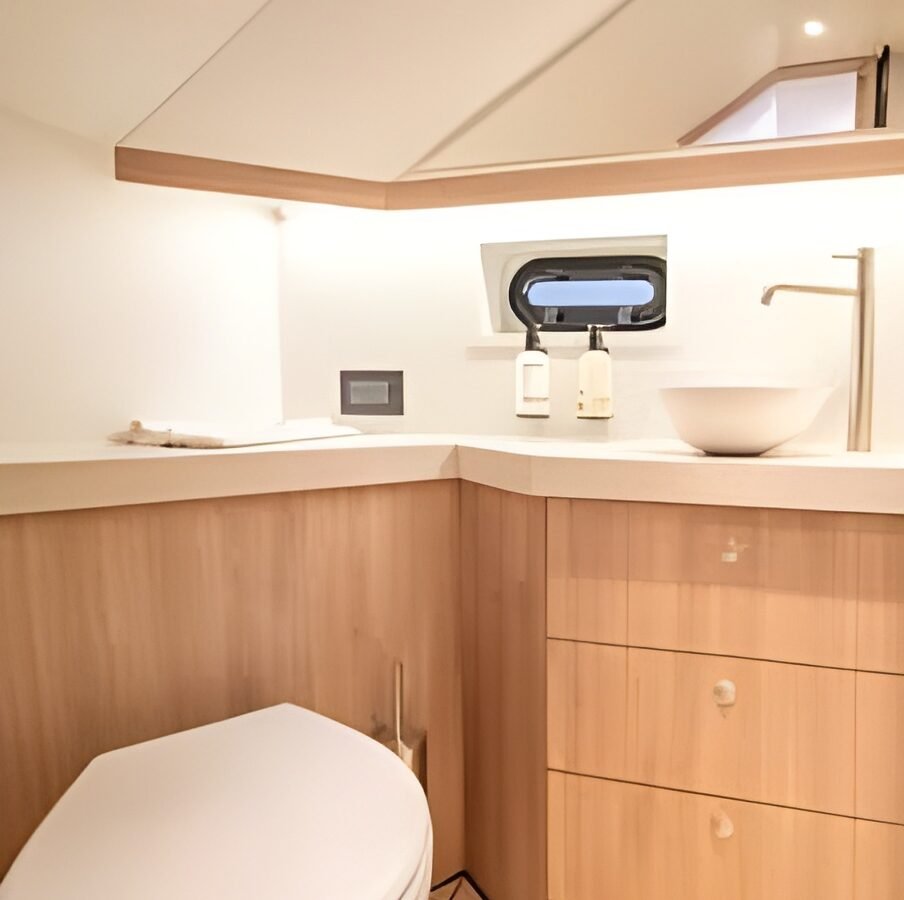Lekker 45 yacht bathroom with modern sink and wood cabinetry