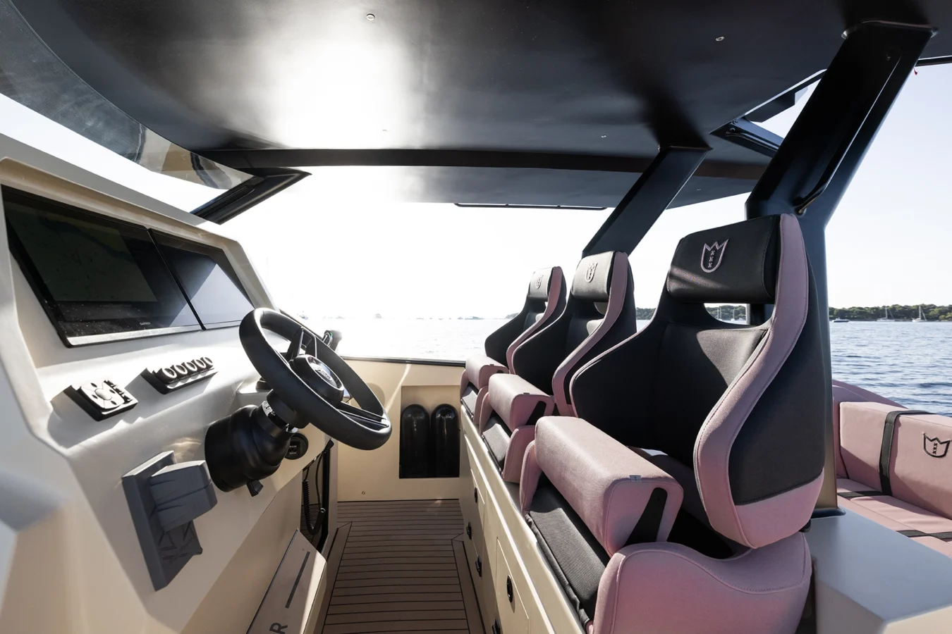 Helm station of the LEKKER 38 yacht featuring ergonomic pilot seats and advanced navigation controls