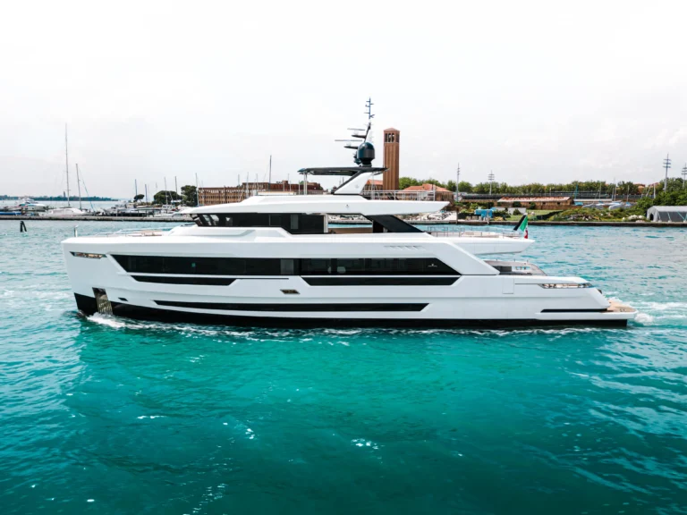 Ocean King Ducale 120 yacht underway, showing port-side profile and sleek modern hull design