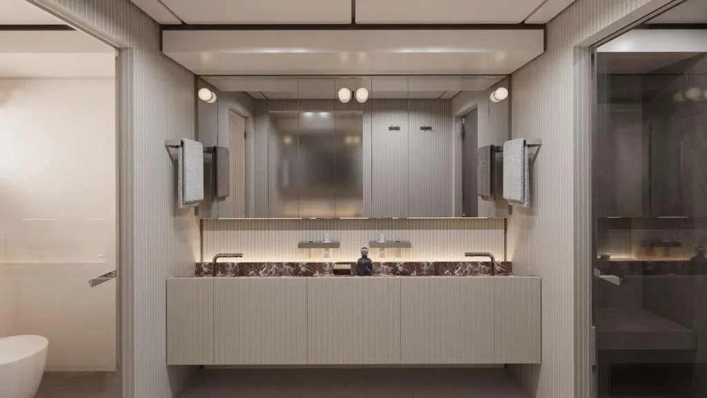 Luxury ensuite bathroom aboard the Ocean King DOGE 400 explorer yacht featuring dual sinks, marble surfaces, and refined modern finishes.