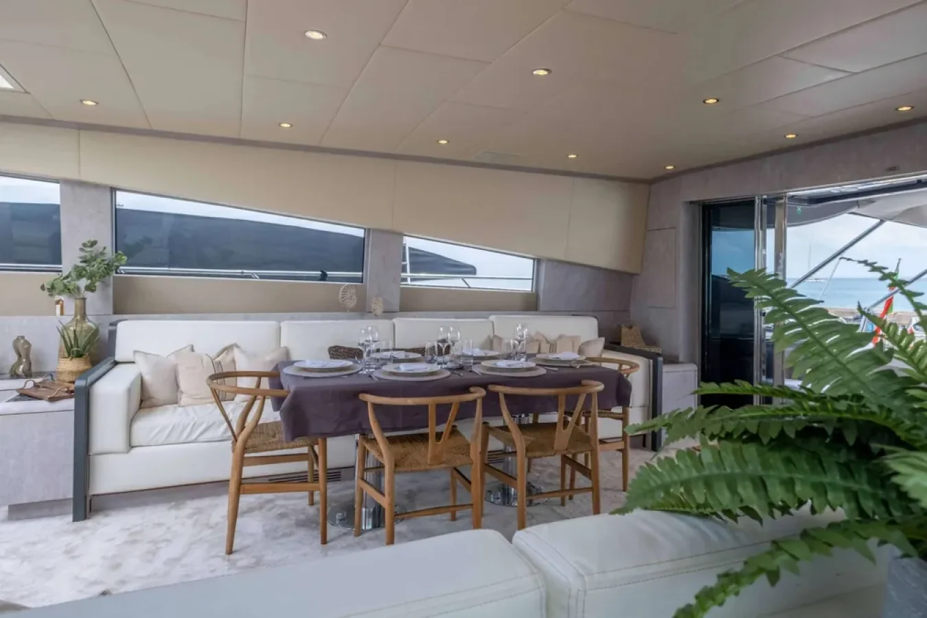 Experience elegant dining aboard the LEOPARD 102 DARK KNIGHT Yacht, with sea views—perfect for a yacht for charter.