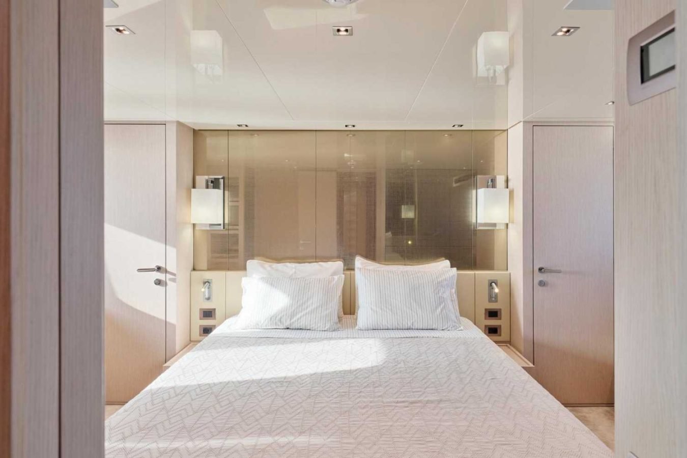 Modern minimalist bedroom inspired by Sanlorenzo SX76 Fuquet Duet, with double bed, white linens, and beige walls.